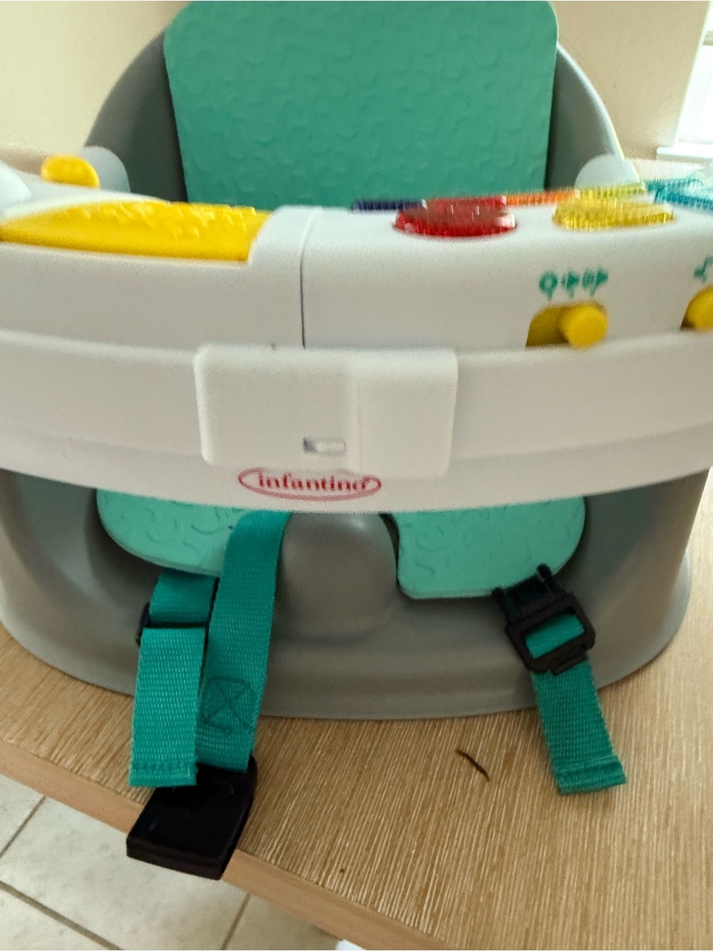 Infantino Teal and White Activity Seat Insert with Yellow Play Tray